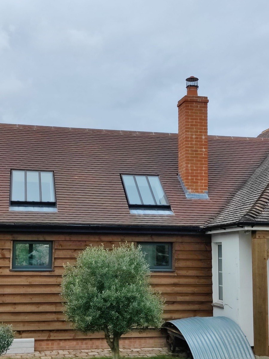 A house with a newly tiled roof and rooflights
