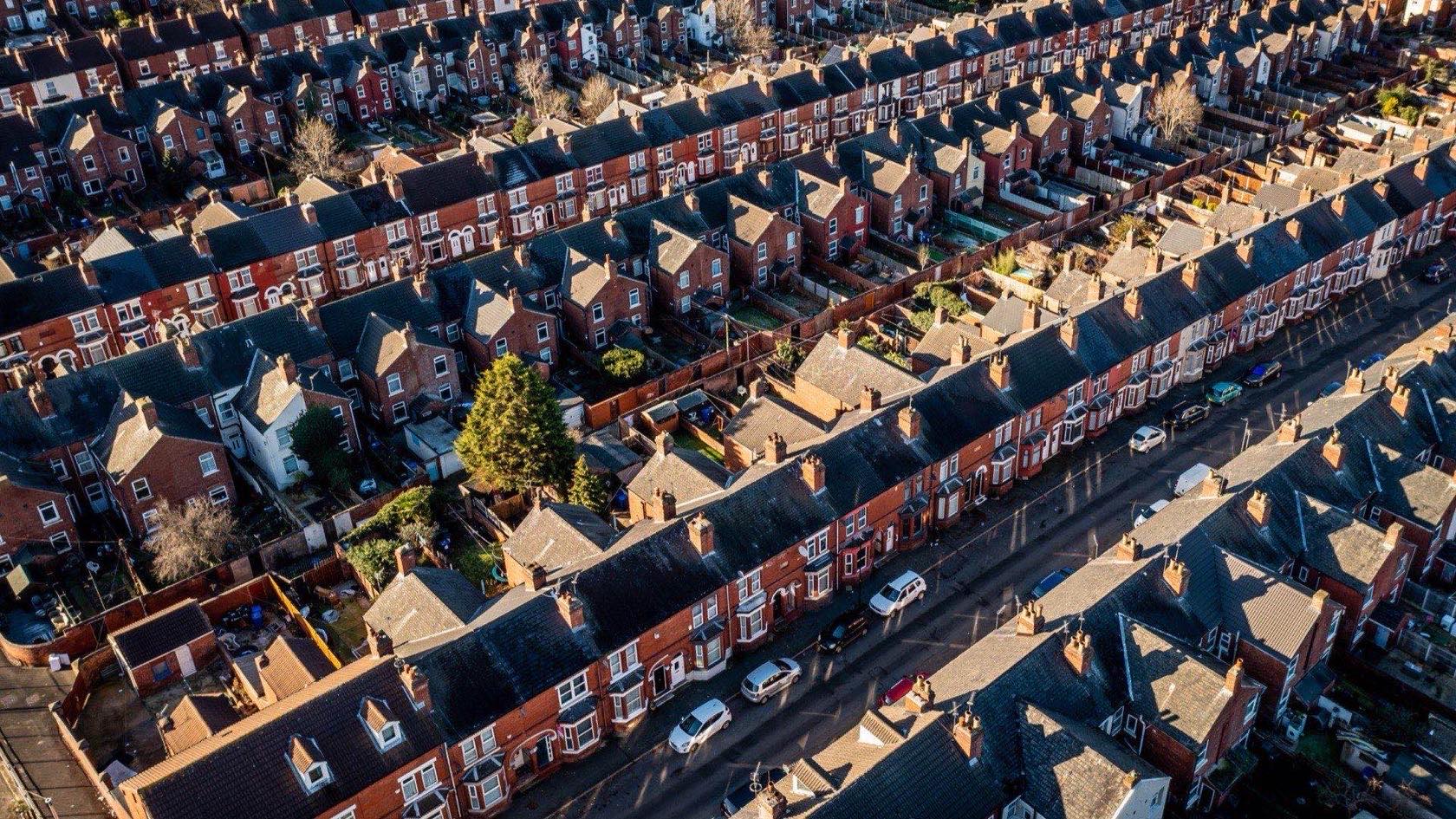 Aerial view of rows of rooftops across a UK town