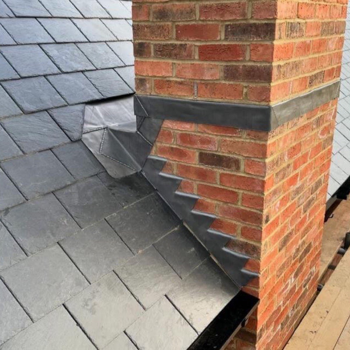 Lead flashing and slate work around a chimney